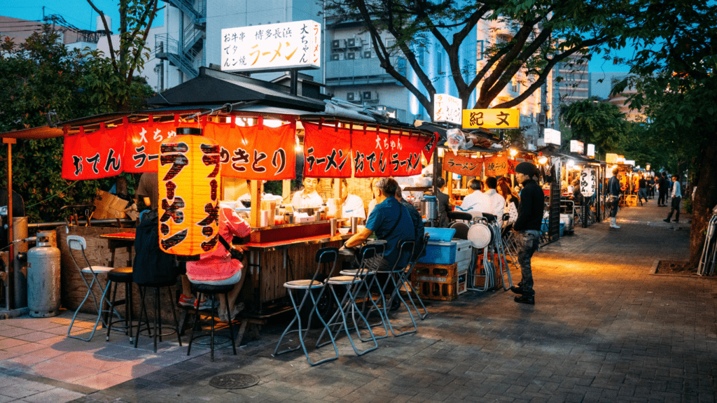 people eating in street food japan restaurant