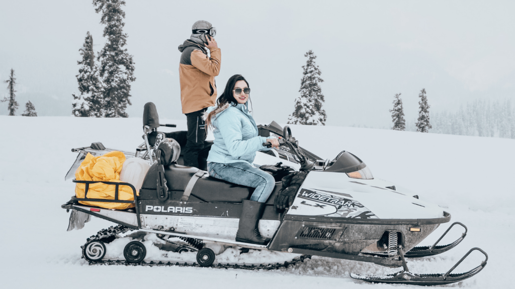 woman riding on snow mobile