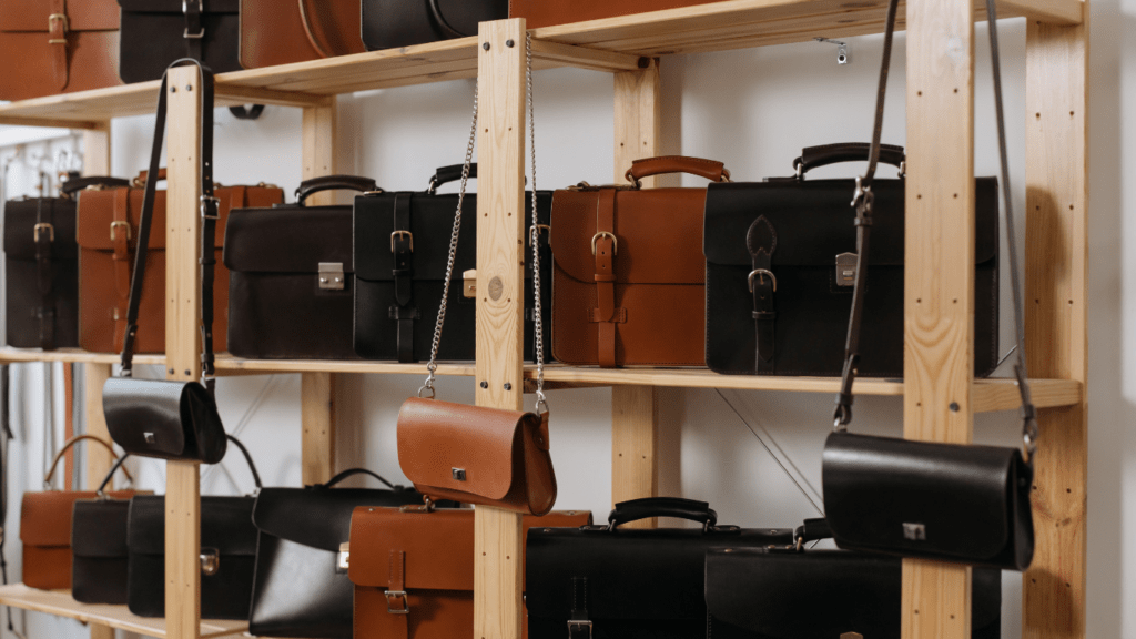 leather bags on wooden shelves