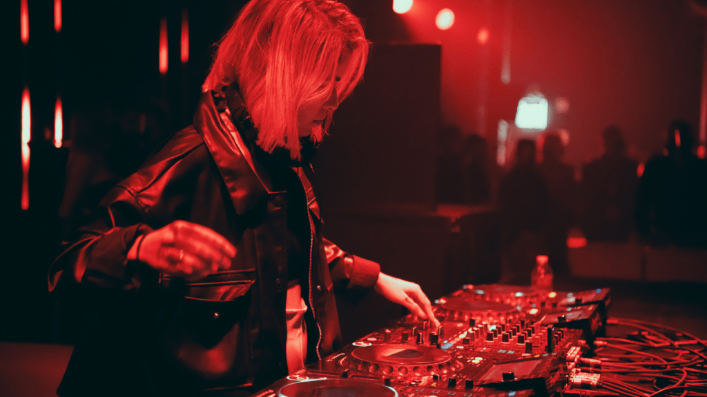 woman playing dj mixer