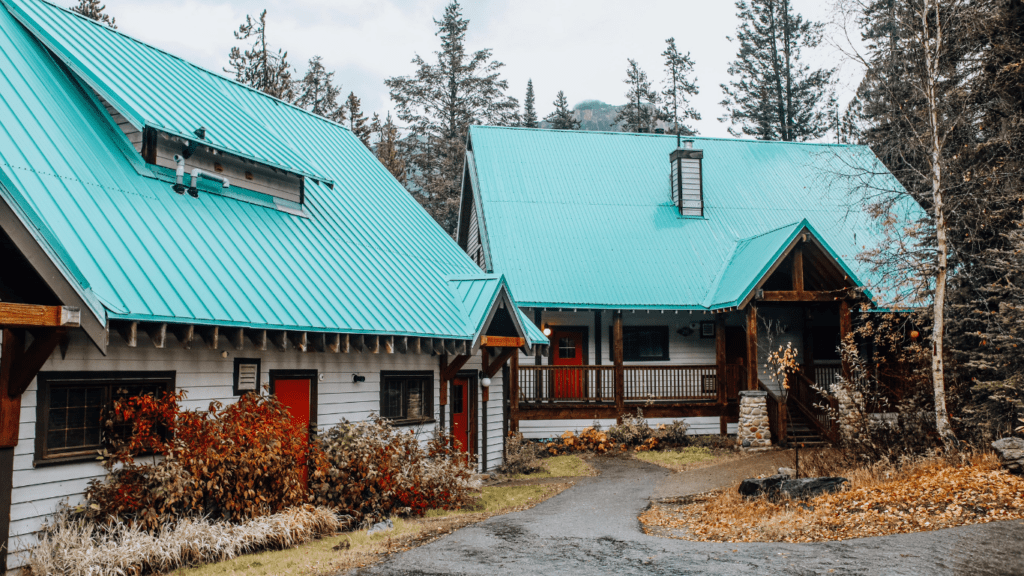 two chalets with turquoise roof